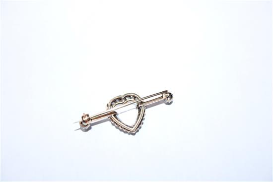 A diamond and moonstone bar brooch, heart-shaped setting in yellow metal (one stone missing), boxed 40mm.